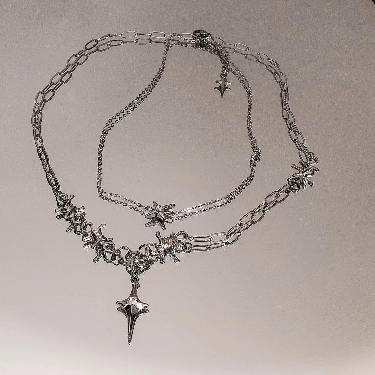 Double stacked wearing four mangoes stitching necklace female 2022 new niche design cold wind cross collarbone chain