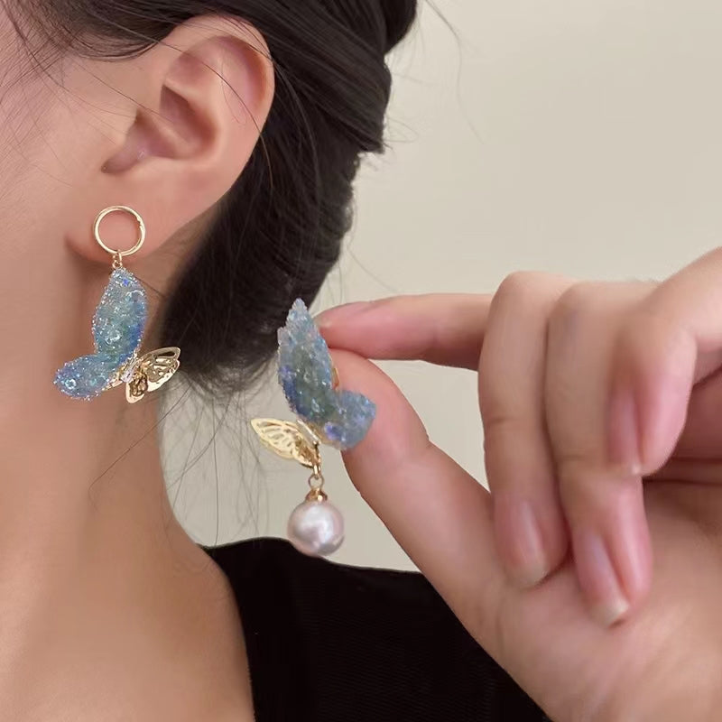 Super fairy cute pink butterfly pearl earrings female Japanese and Korean design senior sense niche earrings earrings summer