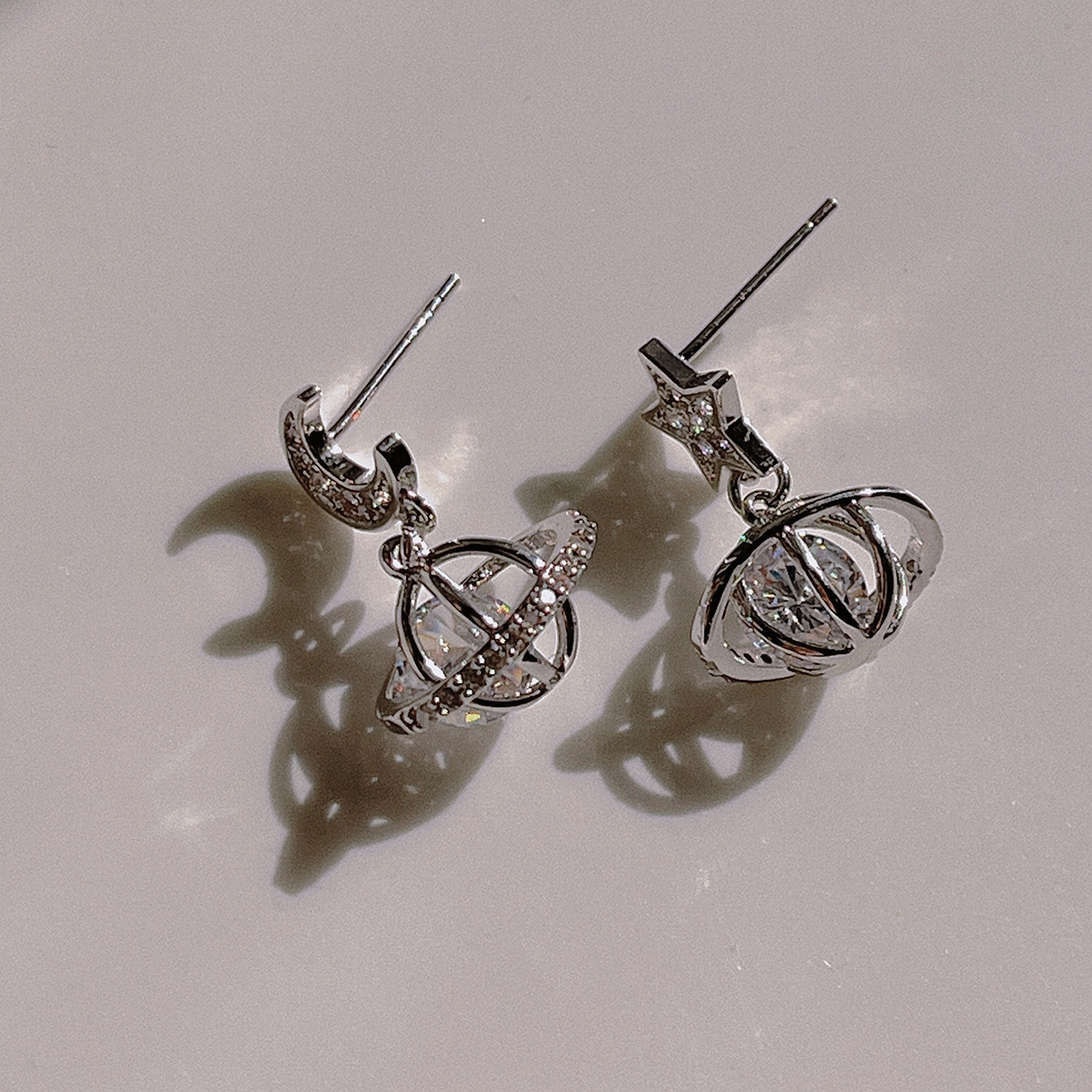 Asymmetrical sparkling stars and moons, three-dimensional micro-set zircon, exquisite and simple 925 silver earrings, female
