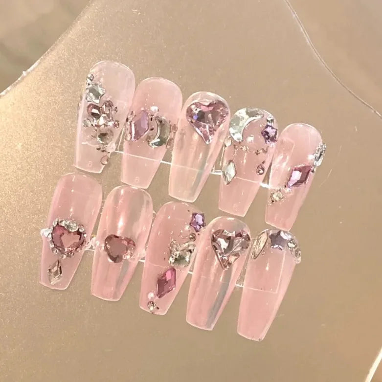 Artificial nails are worn by hand, showing white and pink French flash diamond rose lovers' manicure wedding nails are removable