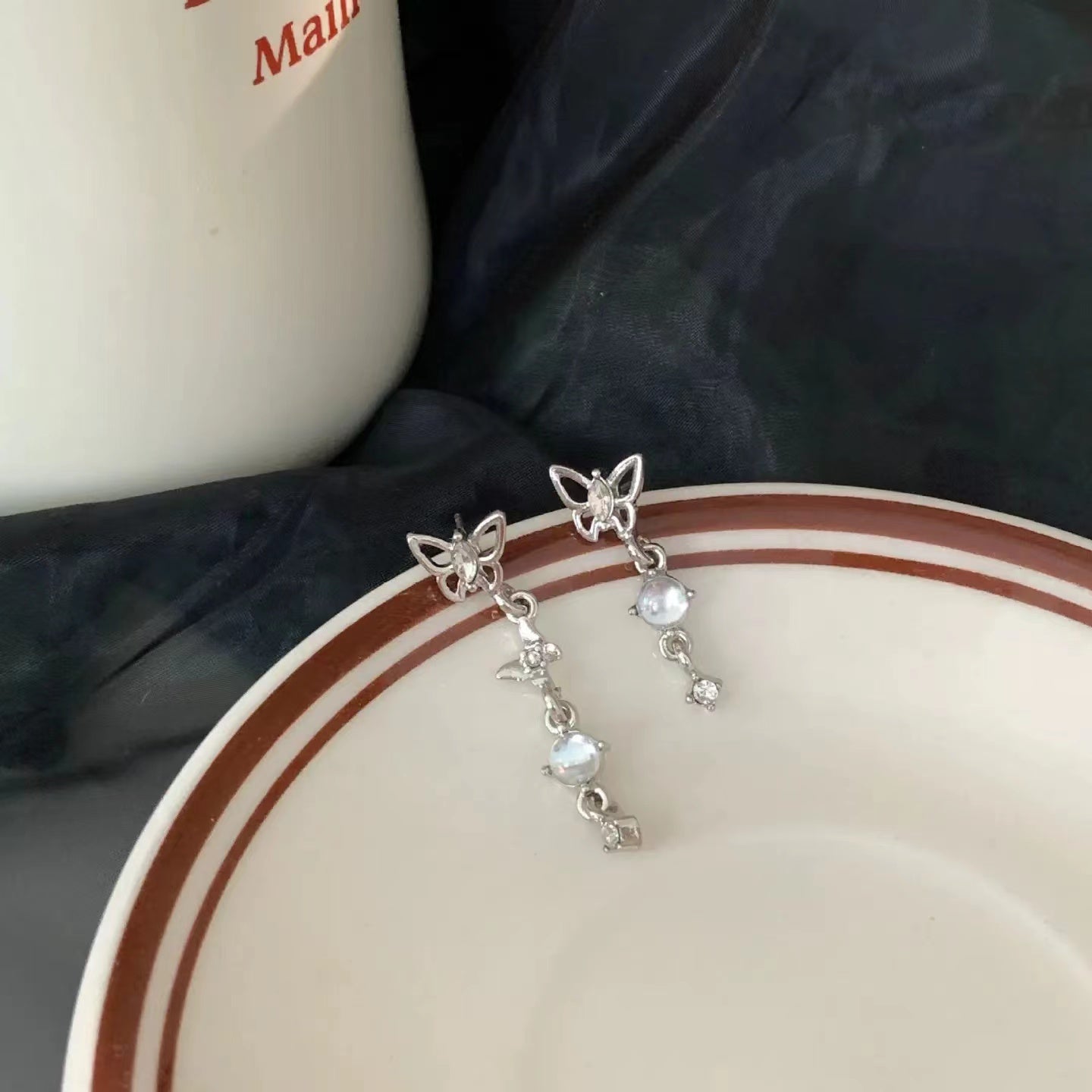 S925 silver pin asymmetric butterfly tassel earrings female South Korea light luxury niche design senior ear clip earrings