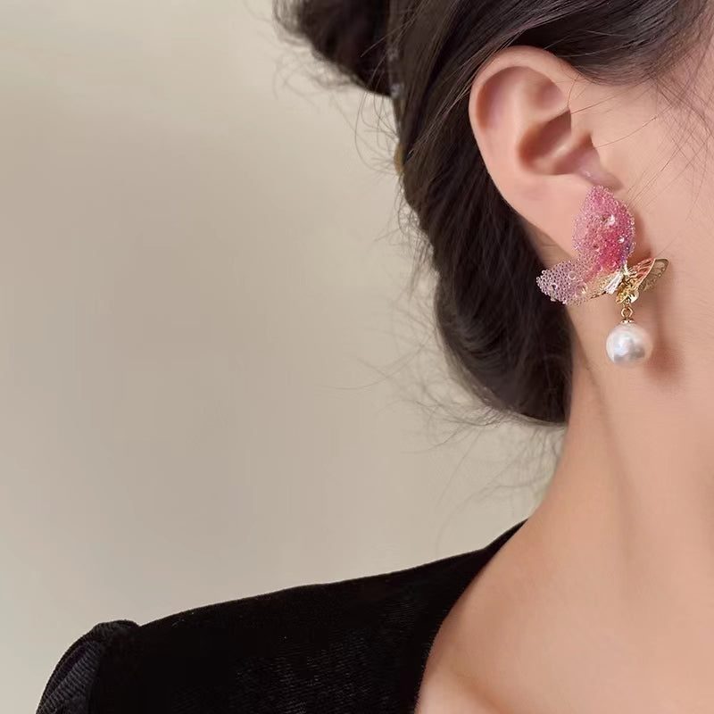 Super fairy cute pink butterfly pearl earrings female Japanese and Korean design senior sense niche earrings earrings summer
