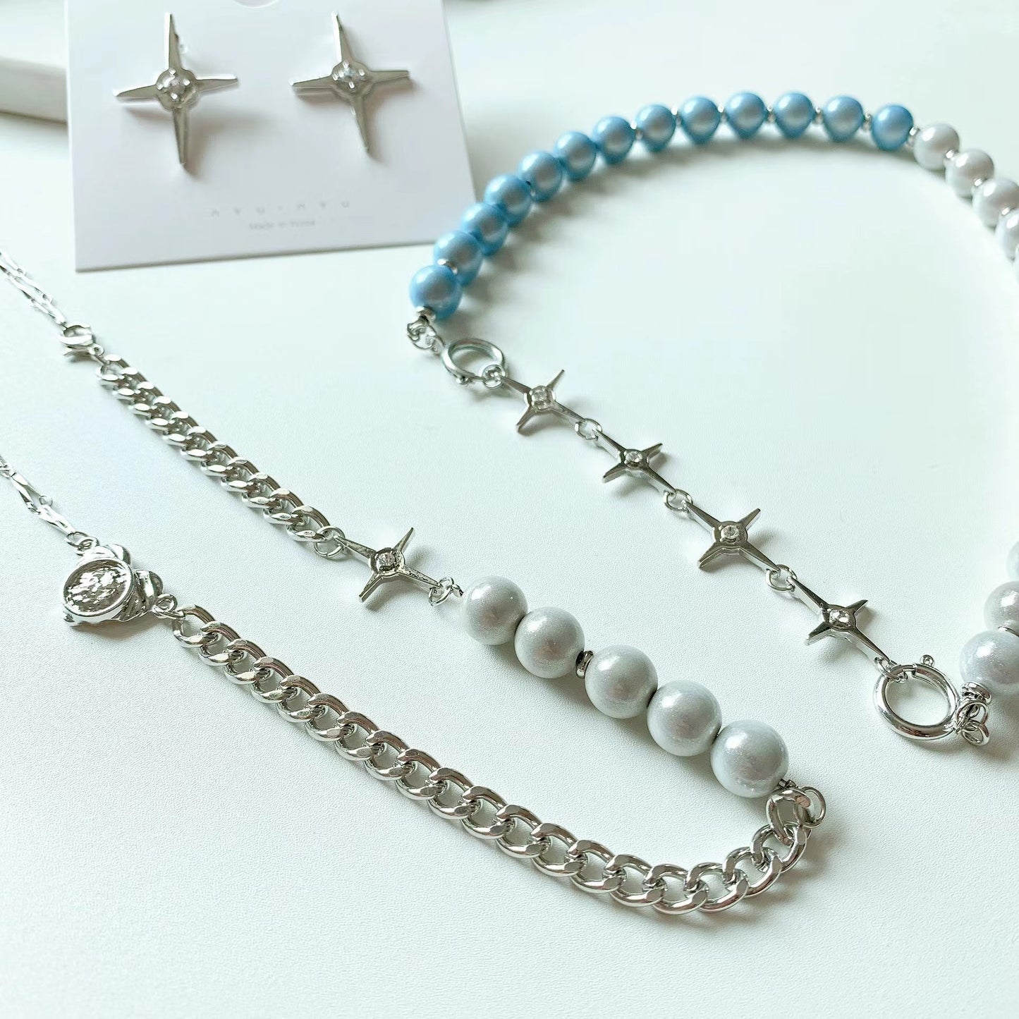 Reflective blue and white pearl cross patchwork necklace