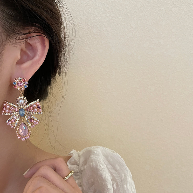 Pink exaggerated pearl bow earrings, unique design sense, light luxury earrings, evening dress earrings, female